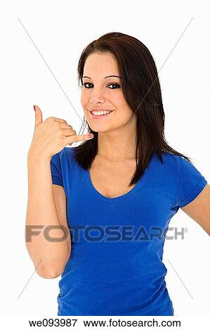 Caucasian woman in her early 20s displaying some attitude holding her hand in the call me position View Large Photo Image Stock Photo - Caucasian woman in her early 20s displaying some attitude holding her hand in the call me position. Fotosearch