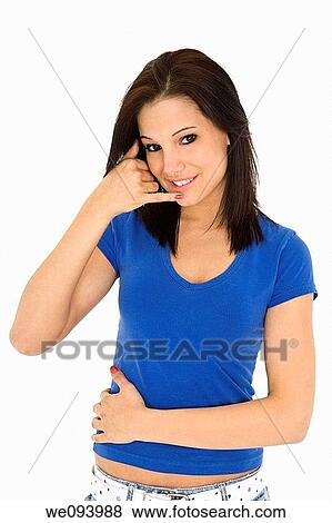 Caucasian woman in her early 20s displaying some attitude holding her hand in the call me position View Large Photo Image Stock Photo - Caucasian woman in her early 20s displaying some attitude holding her hand in the call me position. Fotosearch