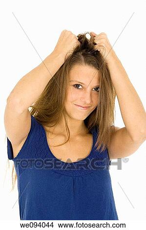 Picture - Caucasian woman looking stressed out on a white background. Fotosearch