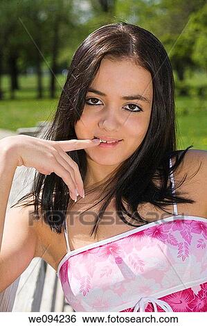 Caucasion teenage girl looking at the camera and smiling View Large Photo Image Stock Photograph - Caucasion teenage girl looking at the camera and smiling. Fotosearch