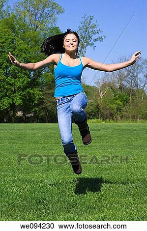 Caucasion teenage girl playing in the park View Large Photo Image Stock Image - Caucasion teenage girl playing in the park. Fotosearch