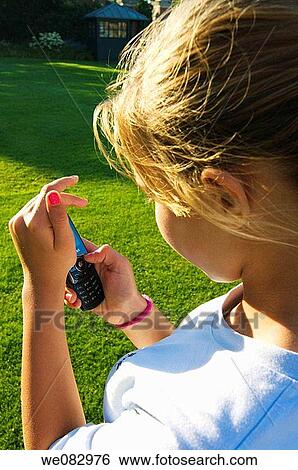cell phone, contemporary, communication, child, addiction View Large Photo Image Stock Photograph - cell phone, contemporary, communication, child, addiction. Fotosearch