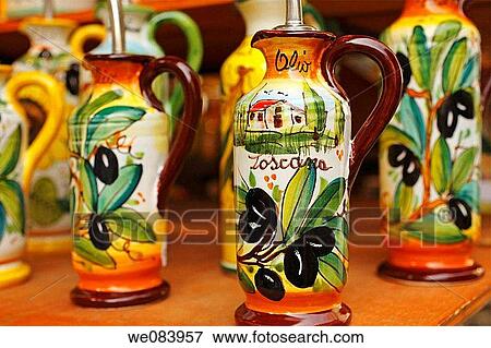Stock Photo - Ceramic olive oil bottles on display, Central Market, Florence, Italy. Fotosearch