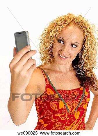 Chica joven haciendose una fotografia View Large Photo Image Stock Image - Chica joven haciendose una fotografia. Fotosearch