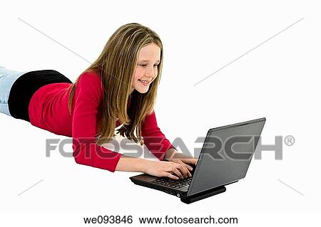 Child laying on a white background working on laptop computer View Large Photo Image Stock Photograph - Child laying on a white background working on laptop computer. Fotosearch