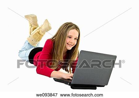 Child laying on a white background with a laptop computer View Large Photo Image Stock Photo - Child laying on a white background with a laptop computer. Fotosearch