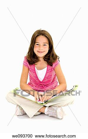 Child sitting on a white background with school books and smiling View Large Photo Image Stock Image - Child sitting on a white background with school books and smiling. Fotosearch