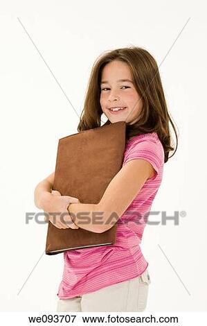 Child standing with school books on white background View Large Photo Image Stock Photo - Child standing with school books on white background. Fotosearch