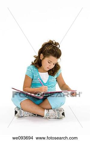 Child working on homework on white background View Large Photo Image Picture - Child working on homework on white background. Fotosearch