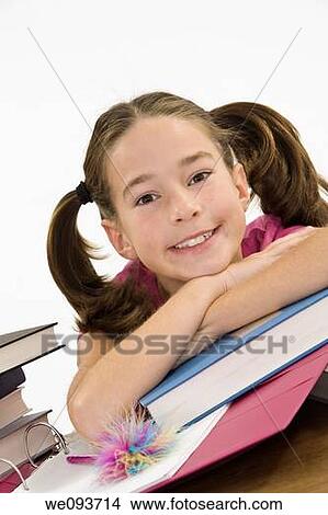 Child working on homework on white background View Large Photo Image Picture - Child working on homework on white background. Fotosearch