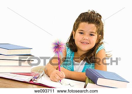 Child working on homework on white background View Large Photo Image Stock Image - Child working on homework on white background. Fotosearch