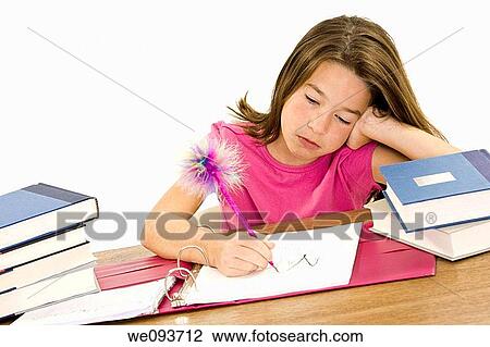 Child working on homework on white background View Large Photo Image Stock Image - Child working on homework on white background. Fotosearch