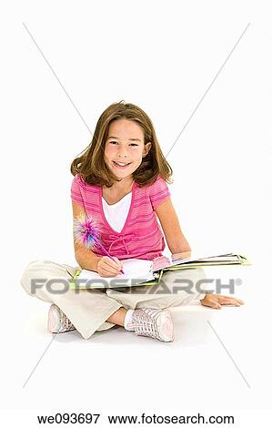Child working on homework on white background View Large Photo Image Stock Photo - Child working on homework on white background. Fotosearch