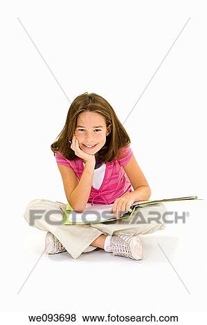 Stock Photo - Child working on homework on white background. Fotosearch