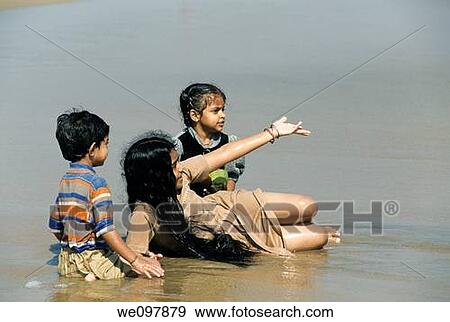 Childern playing on the beach, Marina Beach, Chennai, Madras, Tamil Nadu View Large Photo Image Stock Photo - Childern playing on the beach, Marina Beach, Chennai, Madras, Tamil Nadu. Fotosearch
