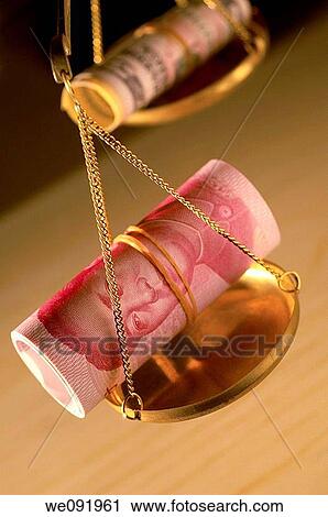 Chinese yuan notes and US dollars rolled up on weighing balance View Large Photo Image Stock Image - Chinese yuan notes and US dollars rolled up on weighing balance. Fotosearch