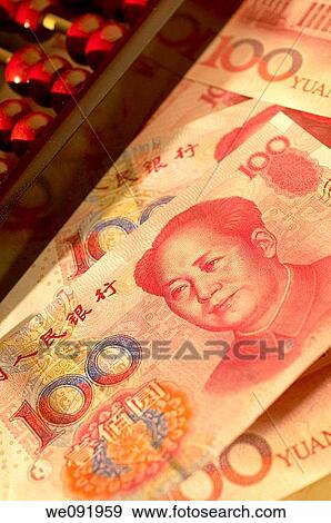 Stock Photo - Chinese yuan notes with abacus. Fotosearch