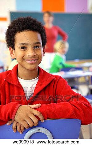 classroom, absent-mindedness, child, boy, black hair, Absent-minded View Large Photo Image Stock Photo - classroom, absent-mindedness, child, boy, black hair, Absent-minded. Fotosearch