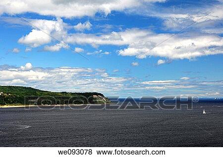 Cliff with the village Tadoussac extending into the vast St Lawrence River, Tadoussac, Priovince of Quebec, Canada View Large Photo Image Stock Photo - Cliff with the village Tadoussac extending into the vast St Lawrence River, Tadoussac, Priovince of Quebec, Canada. Fotosearch