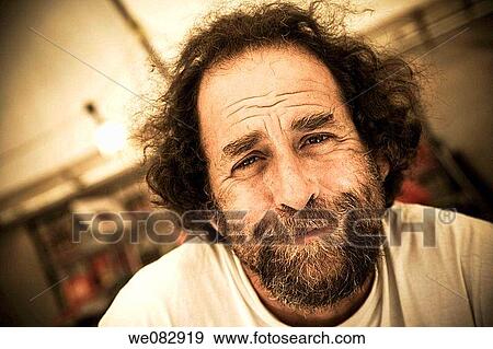 Close-up of a man in a bookstall at a fair View Large Photo Image Stock Photo - Close-up of a man in a bookstall at a fair. Fotosearch