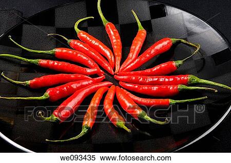 Close up of a ring of red hot Chili Peppers on a black plate View Large Photo Image Stock Photography - Close up of a ring of red hot Chili Peppers on a black plate. Fotosearch