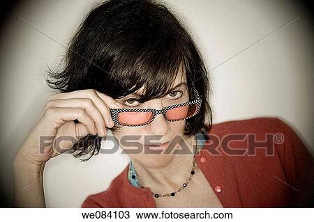 Close-up of a young woman wearing sunglasses. View Large Photo Image Stock Image - Close-up of a young woman wearing sunglasses.. Fotosearch