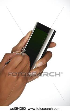 Close up of an African American woman holding a PDA View Large Photo Image Stock Image - Close up of an African American woman holding a PDA. Fotosearch