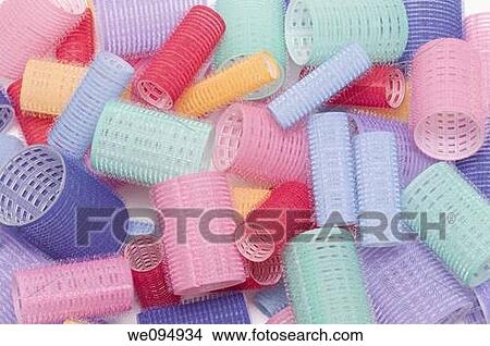 Close up of colorful hair rollers on white background View Large Photo Image Picture - Close up of colorful hair rollers on white background. Fotosearch
