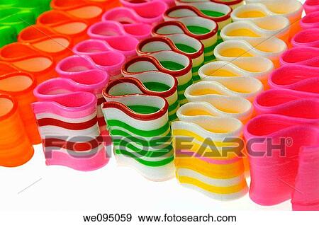 Close up of diagonal strips of colorful thin ribbon candy View Large Photo Image Stock Photo - Close up of diagonal strips of colorful thin ribbon candy. Fotosearch