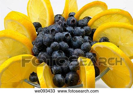 Close up of ring of lemons in a fruit cup with wet blueberries on white View Large Photo Image Stock Image - Close up of ring of lemons in a fruit cup with wet blueberries on white. Fotosearch