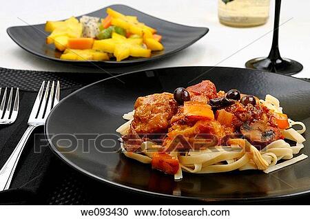 Close up of table setting with plate of Chicken Marengo with fruit salad and white wine View Large Photo Image Stock Image - Close up of table setting with plate of Chicken Marengo with fruit salad and white wine. Fotosearch