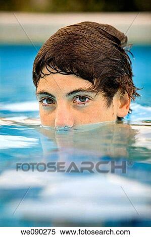 close-up portrait of a young teenager in a swimming pool View Large Photo Image Stock Photography - close-up portrait of a young teenager in a swimming pool. Fotosearch