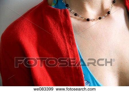 Close_up of a young woman's chest and neck, on which is a necklace. View Large Photo Image Stock Photo - Close_up of a young woman's chest and neck, on which is a necklace.. Fotosearch