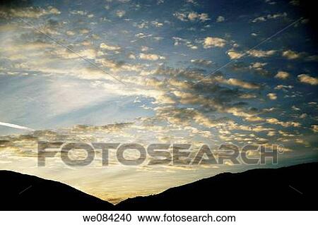 CLOUDS IN THE SKY AT SUNRISE View Large Photo Image Stock Image - CLOUDS IN THE SKY AT SUNRISE. Fotosearch