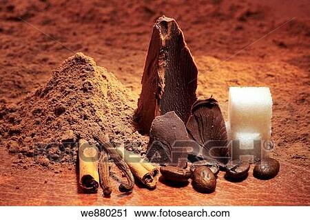 Stock Image - Cocoa powder, cinnamon and vanilla sticks, coffee beans, sugar and chocolate. Fotosearch