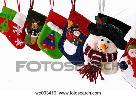 Collection of Christmas stockings with snowmen hanging on white background View Large Photo Image Stock Photo - Collection of Christmas stockings with snowmen hanging on white background. Fotosearch