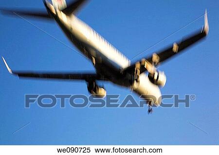 Commercial jet airplane landing with motion effect, Dorval, Quebec, Canada View Large Photo Image Stock Photography - Commercial jet airplane landing with motion effect, Dorval, Quebec, Canada. Fotosearch
