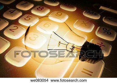 Composite of Calculator and Light Bulb View Large Photo Image Picture - Composite of Calculator and Light Bulb. Fotosearch