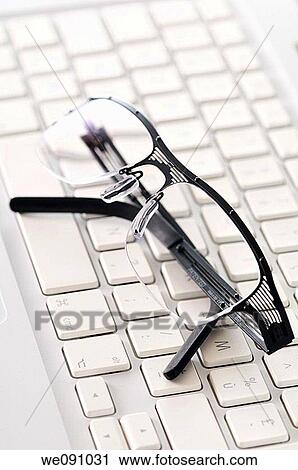 Stock Image - computer and glasses. Fotosearch
