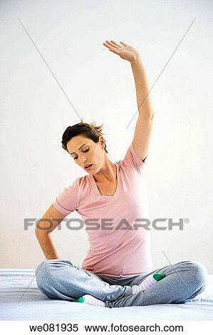contemporary, cross-legged, Arms raised View Large Photo Image Stock Photography - contemporary, cross-legged, Arms raised. Fotosearch