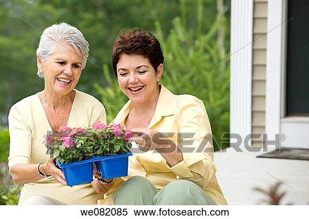 Stock Photography - contemporary, day, Female, flower pot. Fotosearch