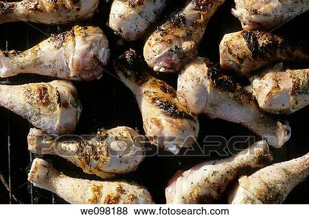 Cooking chicken legs on a barbecue View Large Photo Image Stock Photo - Cooking chicken legs on a barbecue. Fotosearch