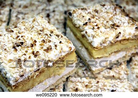 Stock Image - Costrada puff pastries with cream and meringue typical from Alcala de Henares Madrid Spain. Fotosearch