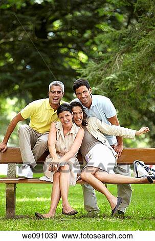 Couples sitting on bench in a garden, spa, Lierganes, Cantabria, Spain View Large Photo Image Stock Photo - Couples sitting on bench in a garden, spa, Lierganes, Cantabria, Spain. Fotosearch