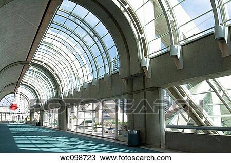 Stock Image - Curved glass ceiling over hallway in San Diego Convention Center. San Diego, California, USA.. Fotosearch