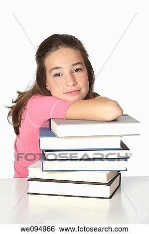 Stock Photograph - Cute Caucasian child working on homework. Fotosearch