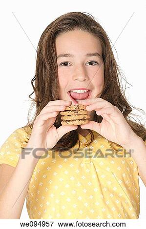 Cute Caucasian girl eating Chocolate Chip Cookies View Large Photo Image Stock Photo - Cute Caucasian girl eating Chocolate Chip Cookies. Fotosearch