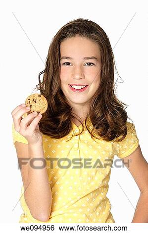 Cute Caucasian girl eating Chocolate Chip Cookies View Large Photo Image Stock Photograph - Cute Caucasian girl eating Chocolate Chip Cookies. Fotosearch