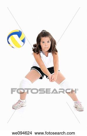 Cute Caucasian girl hitting the ball in volleyball View Large Photo Image Picture - Cute Caucasian girl hitting the ball in volleyball. Fotosearch