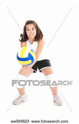 Cute Caucasian girl hitting the ball in volleyball View Large Photo Image Stock Image - Cute Caucasian girl hitting the ball in volleyball. Fotosearch
